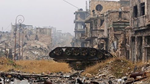 a-damaged-tank-is-pictured-amid-the-damage-near-umayyad-mosque-in-the-government-controlled-area-of-aleppo_5763943